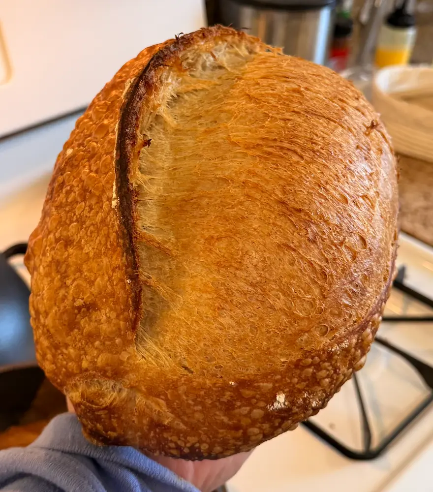 Three sourdough loaves and crumb views, image 1