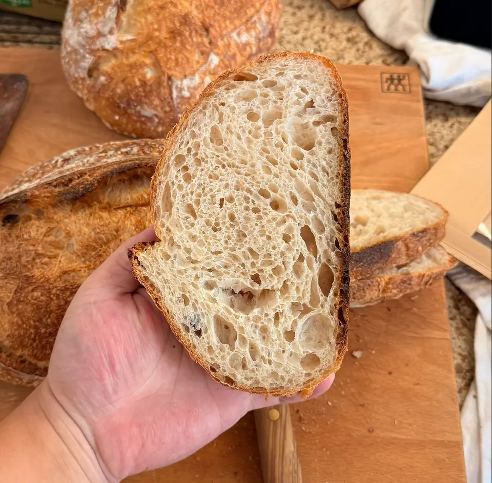 Three sourdough loaves and crumb views, image 2