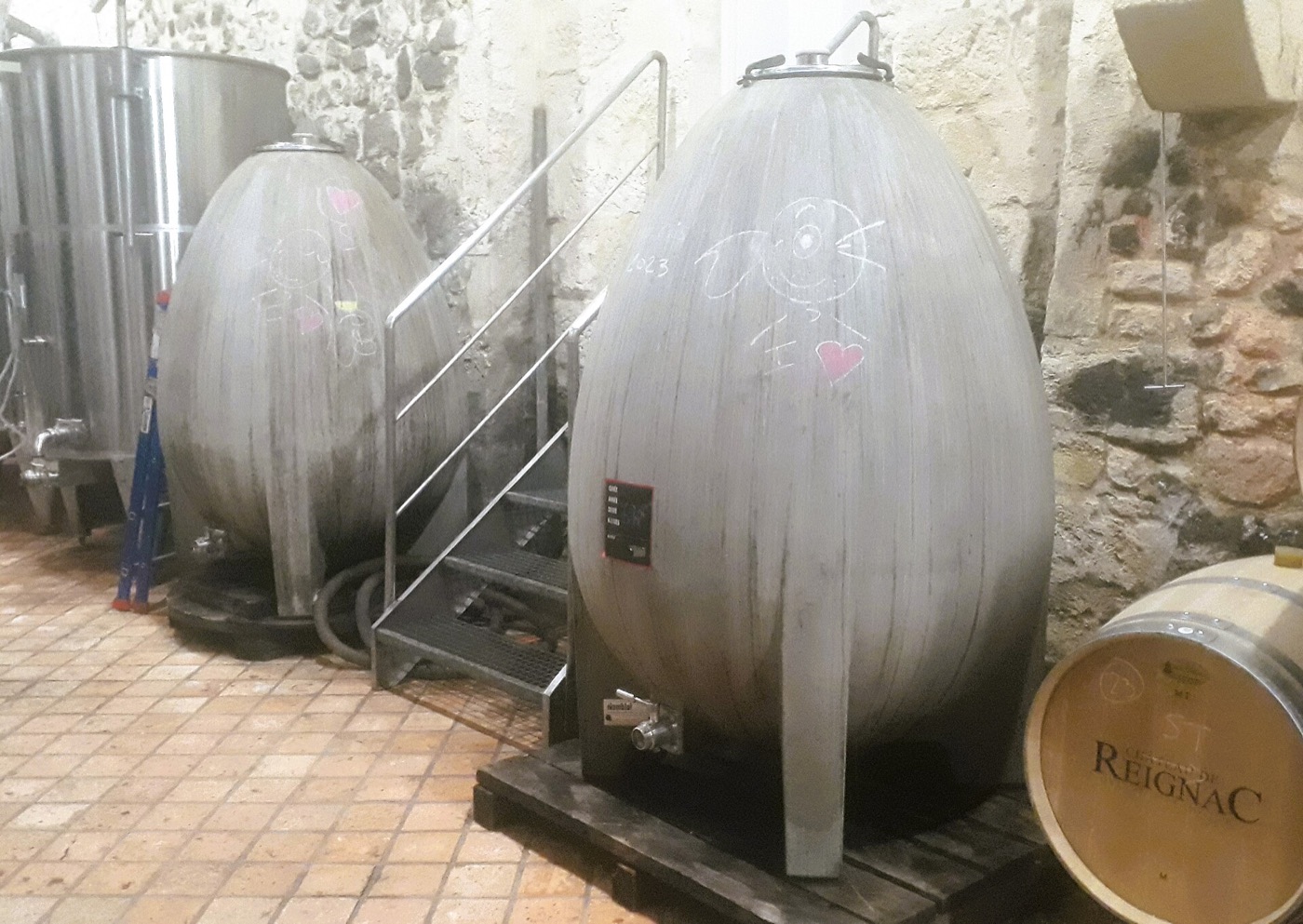 An egg-shaped concrete wine vessel inside a Bordeaux cellar.